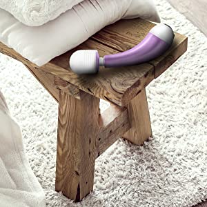 wand lays on table near blankets showing size